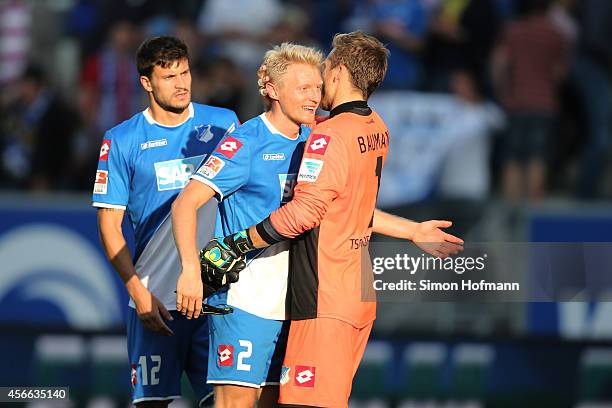 Andreas Beck and goalkeeper Oliver Baumann of Hoffenheim celebrate winning after the Bundesliga match between 1899 Hoffenheim and FC Schalke 04 at...