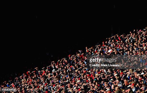 Sunderland supporters shield their eyes from the sun during the Barclays Premier League match between Sunderland and Stoke City at Stadium of Light...