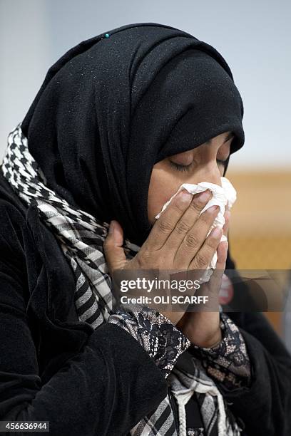 Doctor Shameela Islam-Zulfiqar, who traveled with aid worker Alan Henning on humanitarian missions to Syria, reacts during a press conference in...