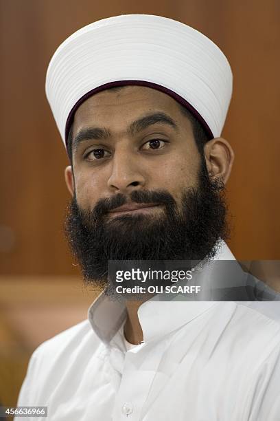 Imam Asim Hussain speaks during a press conference for murdered aid worker Alan Henning in Manchester Central Mosque in Manchester, north west...