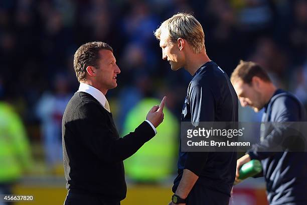 Watford Head Coach Billy McKinlay chats to Brighton & Hove Albion Manager Sami Hyypia after the Sky Bet Championship match between Watford and...