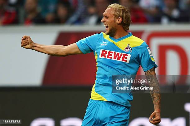 Marcel Risse of Koeln celebrates his team's first goal during the Bundesliga match between Eintracht Frankfurt and 1. FC Koeln at Commerzbank-Arena...