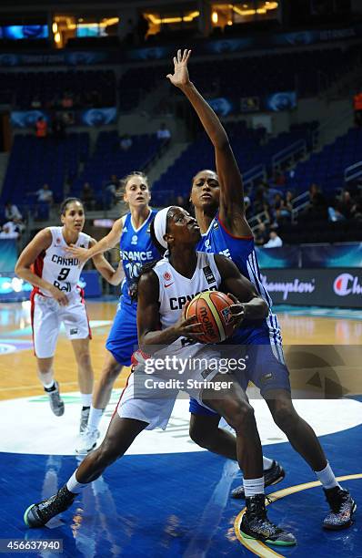 Tamara Tatham of Canada in action with France's Ingrid Tanqueray during the 2014 FIBA Women's World Championships Classification 5-8 basketball match...