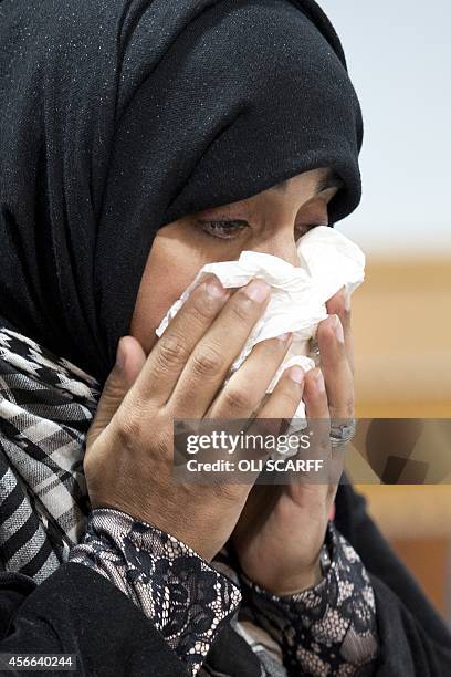 Doctor Shameela Islam-Zulfiqar, who traveled with aid worker Alan Henning on humanitarian missions to Syria, reacts during a press conference in...