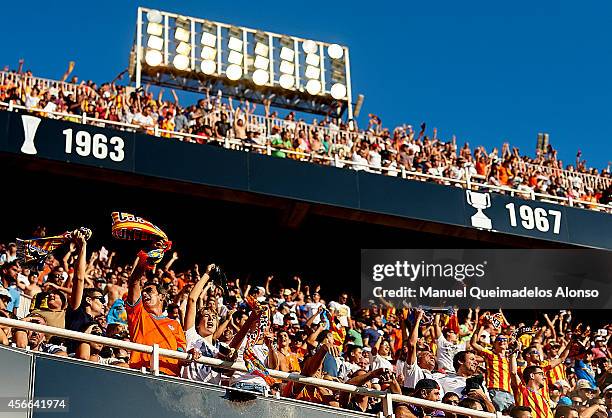 Valencia fans gives support to their team during the La Liga match between Valencia CF and Club Atletico de Madrid at Estadi de Mestalla on October...