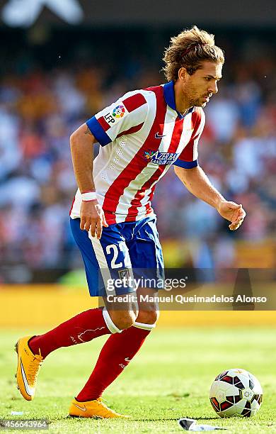 Alessio Cerci of Atletico de Madrid runs with the ball during the La Liga match between Valencia CF and Club Atletico de Madrid at Estadi de Mestalla...