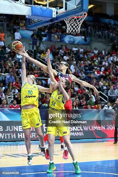 Rachel Jarry and Marianna Tolo of Australia reach for the rebound against Brittney Griner of the Women's Senior U.S. National Team during the...