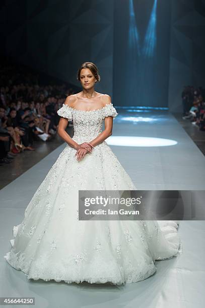 Model walks the runway at the Michael Cinco show during Fashion Forward at Madinat Jumeirah on October 4, 2014 in Dubai, United Arab Emirates.