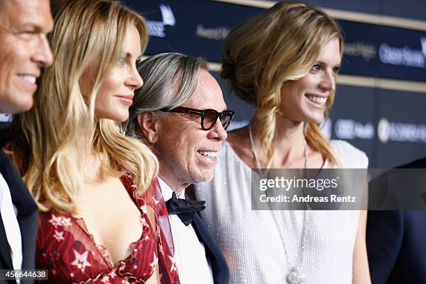 Daniel Grieder, Dee Ocleppo, Tommy Hilfiger and Nadja Schildknecht attend the Award Night Green Carpet Arrivals during Day 10 of Zurich Film Festival...