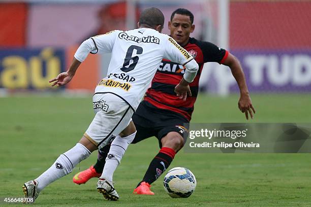 Junior Cesar of Botafogo battles for the ball during the match between Vitoria and Botafogo as part of Brasileirao Series A 2014 at Estadio Manoel...
