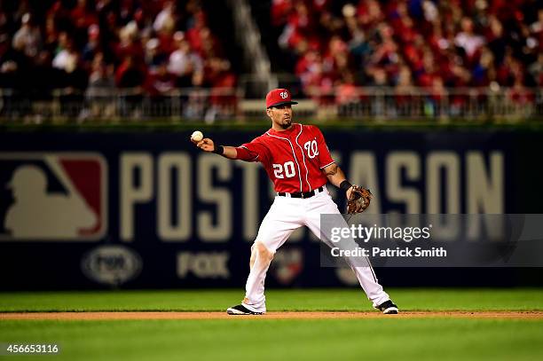 Ian Desmond of the Washington Nationals fields the ball in the sixth inning against Gregor Blanco of the San Francisco Giants during Game Two of the...