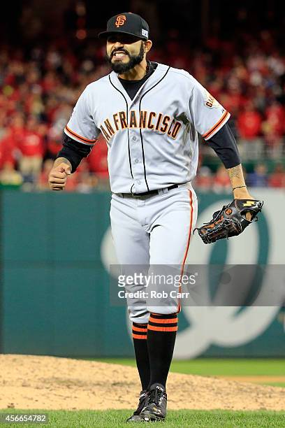 Sergio Romo of the San Francisco Giants celebrates after coming of the mound in the ninth inning against the Washington Nationals during Game Two of...