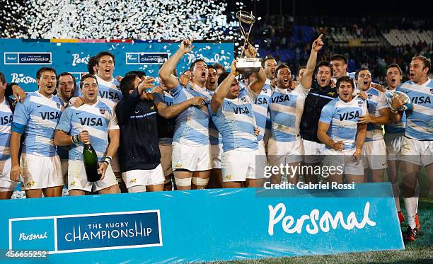 Players of Argentina celebrate with the trophy after winning a match between Argentina Los Pumas and Australia Wallabies as part of The Rugby...