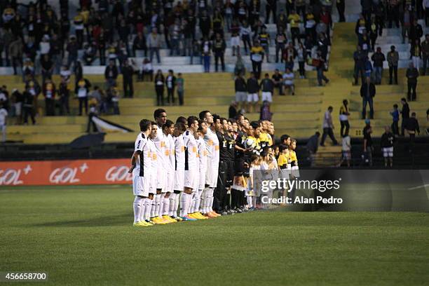 Players of Atletico MG and Criciuma enter into the field before a match between Criciuma and Atletico MG for the Brazilian Series A 2014 at Heriberto...