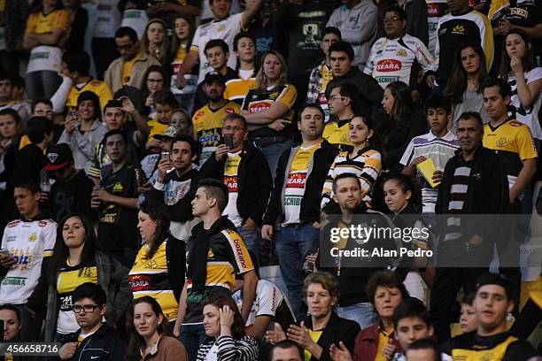 Supporters of Criciuma cheer their team during the match between Criciuma and Atletico MG for the Brazilian Series A 2014 at Heriberto Hulse Stadium...