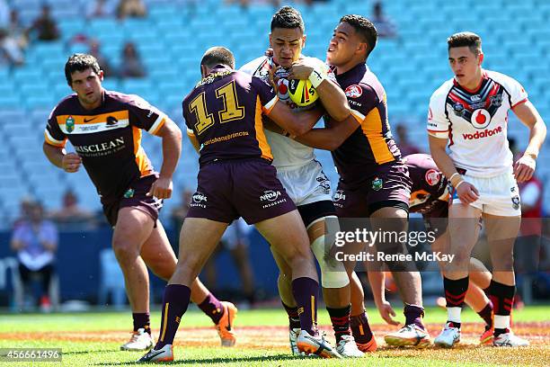 Ken Maumalo of the Warriors is tackled during the 2014 Under 20's Holden Cup Grand Final match between the Brisbane Broncos and the New Zealand...