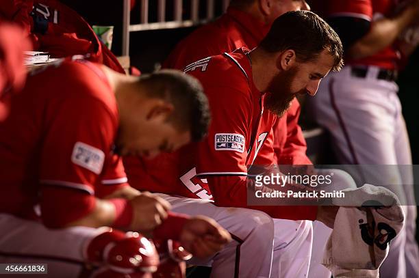 Adam LaRoche of the Washington Nationals looks on in the dugout in the eighteenth inning against the San Francisco Giants during Game Two of the...