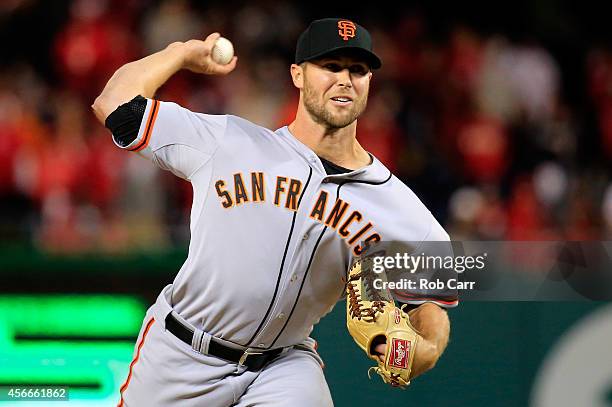 Hunter Strickland of the San Francisco Giants throws a pitch in the eighteenth inning against the Washington Nationals during Game Two of the...