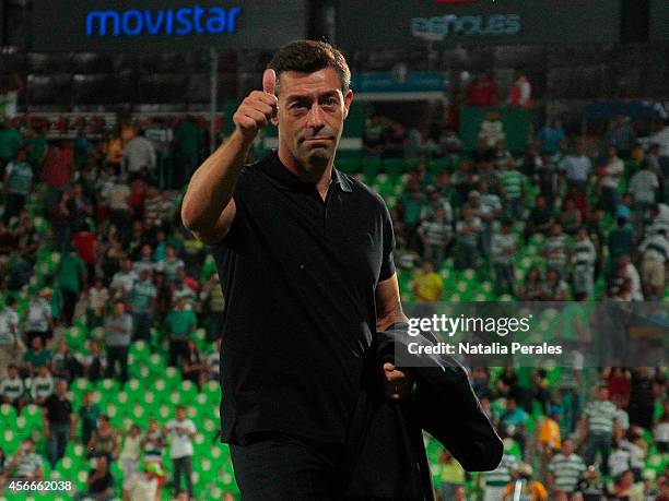 Head coach Pedro Caixinha greets after a match between Santos Laguna and Morelia as part of 12th round Apertura 2014 Liga MX at Corona Stadium on...