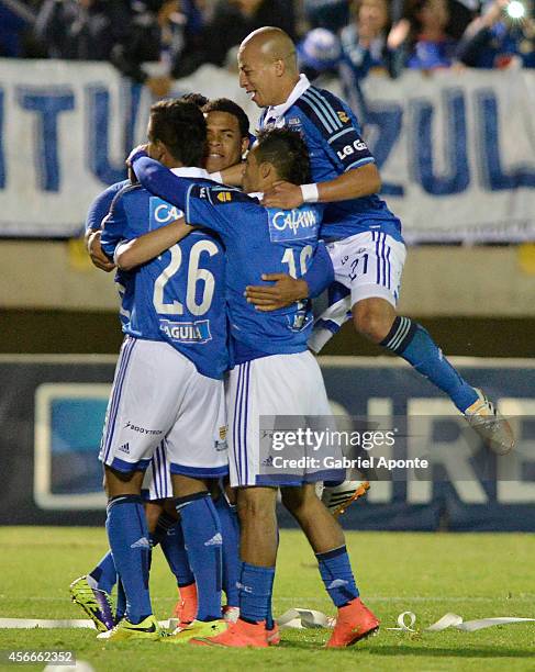 Players of Millonarios celebrate a scored goal during a match between Patriotas and Millonarios as part of 13th round of Liga Postobon 2014 II at La...