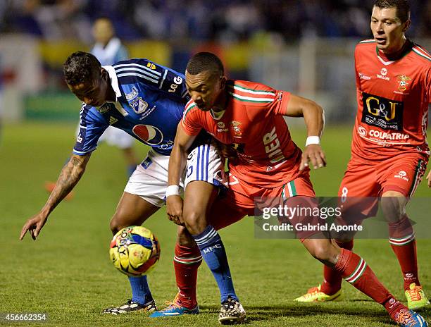 Andy Polo of Millonarios struggles for the ball with Cesar Hinestroza of Patriotas during a match between Patriotas and Millonarios as part of 13th...