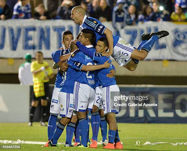 Players of Millonarios celebrate a scored goal during a match between Patriotas and Millonarios as part of 13th round of Liga Postobon 2014 II at La...