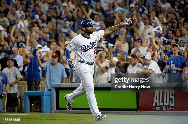 Matt Kemp of the Los Angeles Dodgers celebrates hitting a solo homerun to lead off and take a 3-2 lead in the eighth inning of Game Two of the...