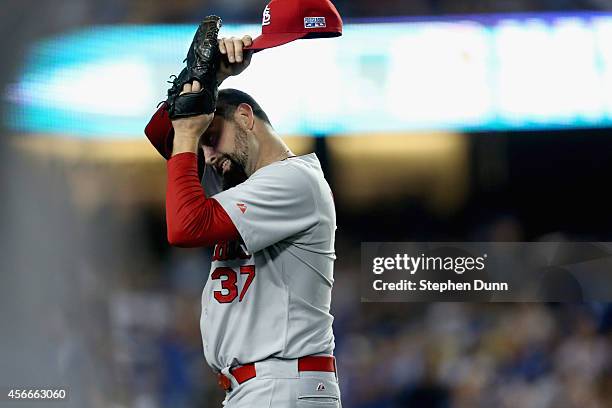 Pitcher Pat Neshek of the St. Louis Cardinals reacts after giving up a homerun to Matt Kemp of the Los Angeles Dodgers in the eighth inning of Game...