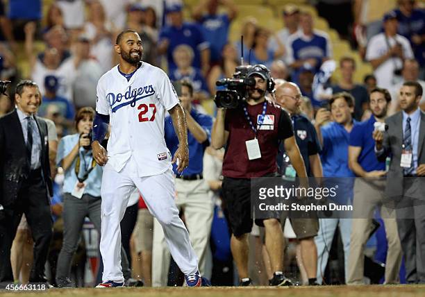Matt Kemp of the Los Angeles Dodgers reacts in celebration of the 3-2 win over the St. Louis Cardinals in Game Two of the National League Division...