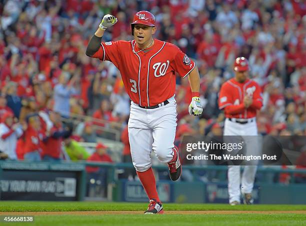 Washington second baseman Asdrubal Cabrera heads for home to score on an RBI single by Washington third baseman Anthony Rendon in the bottom of the...