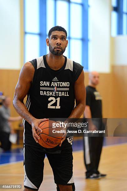 Tim Duncan of the San Antonio Spurs shoots during practice as part of the 2014 Global Games on October 5, 2014 at the Alba practice facility in...