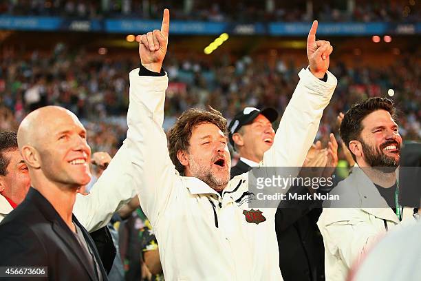 Russell Crowe celebrates the Rabbitohs winning the 2014 NRL Grand Final match between the South Sydney Rabbitohs and the Canterbury Bulldogs at ANZ...