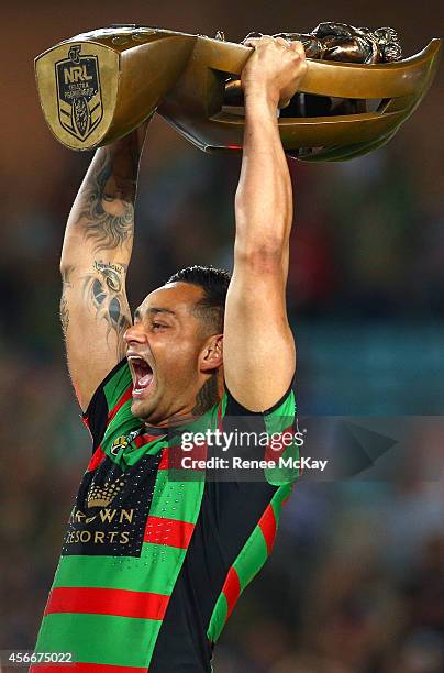 Souths captain John Sutton lifts the Provan Summons trophy after his teams win at the 2014 NRL Grand Final match between the South Sydney Rabbitohs...