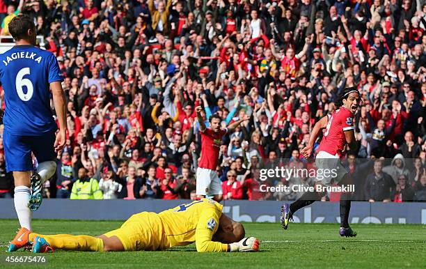 Radamel Falcao of Manchester United celebrates scoring his team's second goal during the Barclays Premier League match between Manchester United and...