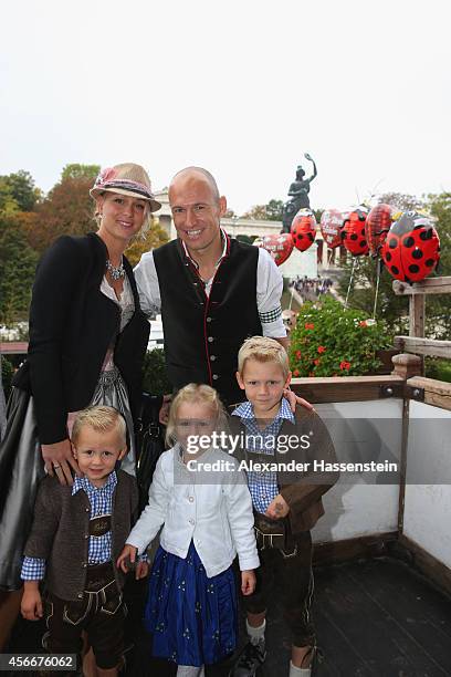 Arjen Robben of Bayern Muenchen poses with his wife Bernadien Robben in front of the ensemble of the Bavaria statue, a monumental bronze sand-cast...