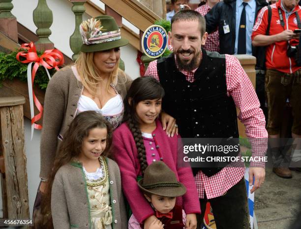 Bayern Munich's French midfielder Franck Ribery arrives with his wife Wahiba Ribery Belhami and their children for the traditional visit of FC Bayern...