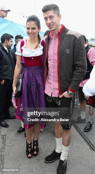 Robert Lewandowski of FC Bayern Muenchen and Anna Stachurska attend the Oktoberfest 2014 beer festival at Kaefers Wiesenschaenke at Theresienwiese on...