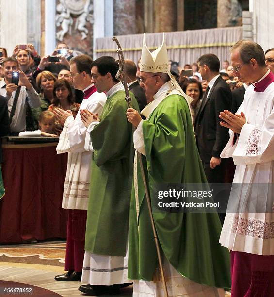 Pope Francis walks in procession to the main altar of St. Peter's Basilica for the Opening Mass of the Synod of Bishops on October 5, 2014 in Vatican...