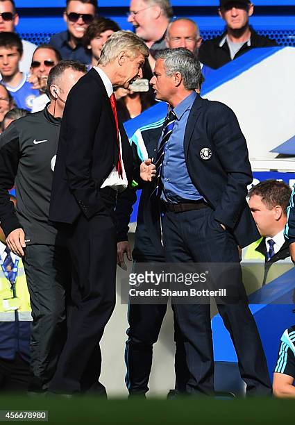 Managers Arsene Wenger of Arsenal and Jose Mourinho manager of Chelsea clash during the Barclays Premier League match between Chelsea and Arsenal at...