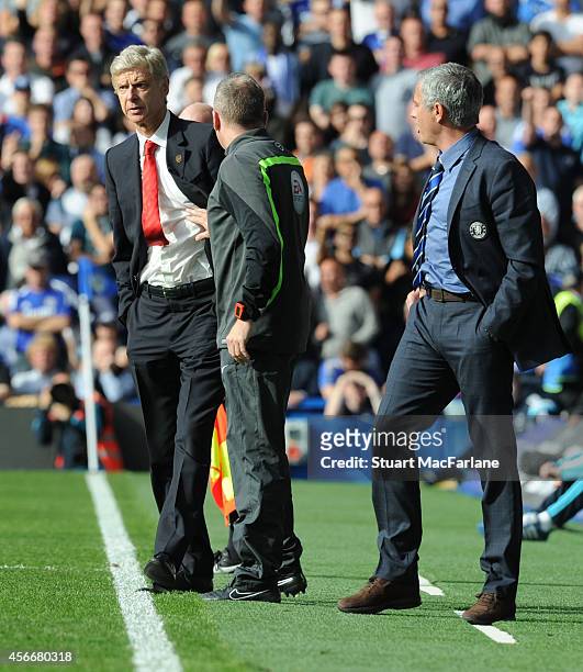 Managers Arsene Wenger of Arsenal and Jose Mourinho of Chelsea clash after a foul on Arsenal's Alexis Sanchez during the Barclays Premier League...