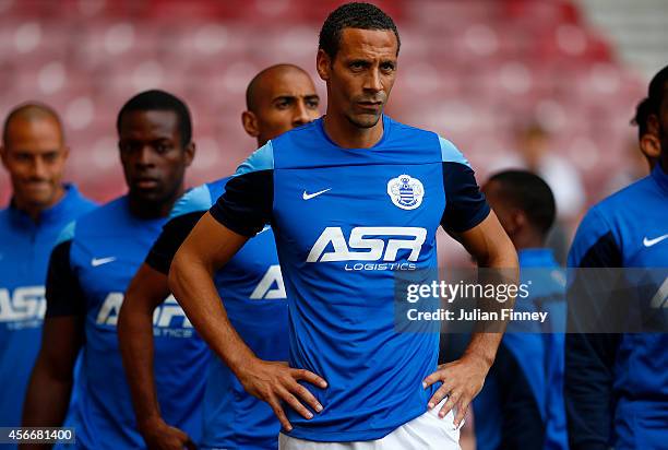 Rio Ferdinand of QPR takes part in the warm-up before the Barclays Premier League match between West Ham United and Queens Park Rangers at Boleyn...