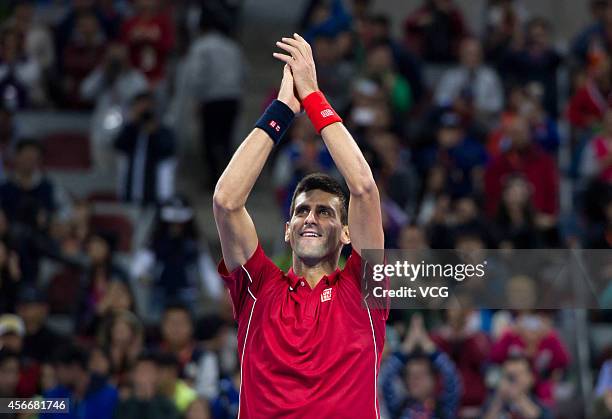 Novak Djokovic of Serbia celebrates after winning the men's singles final match against Tomas Berdych of the Czech Republic during day nine of the...