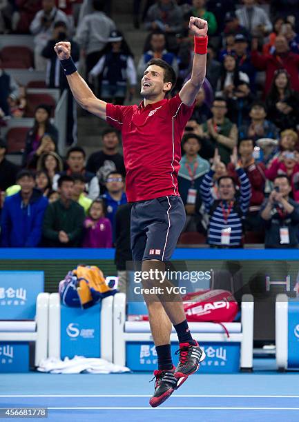 Novak Djokovic of Serbia celebrates after winning the men's singles final match against Tomas Berdych of the Czech Republic during day nine of the...