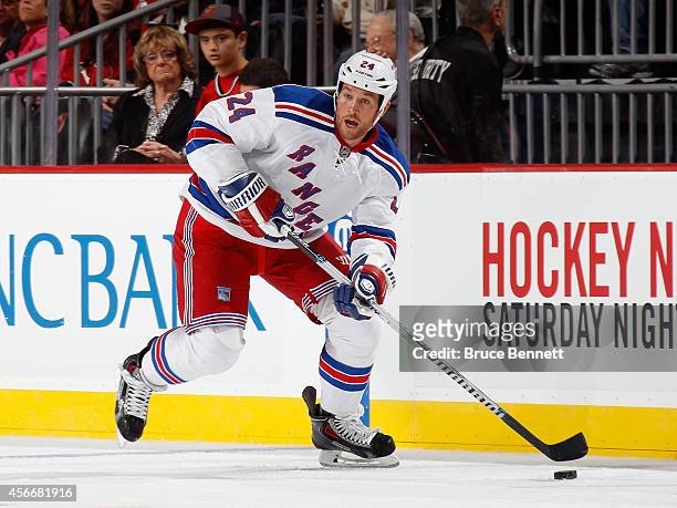 Ryan Malone of the New York Rangers skates against the New Jersey Devils at the Prudential Center on October 4, 2014 in Newark, New Jersey. The...