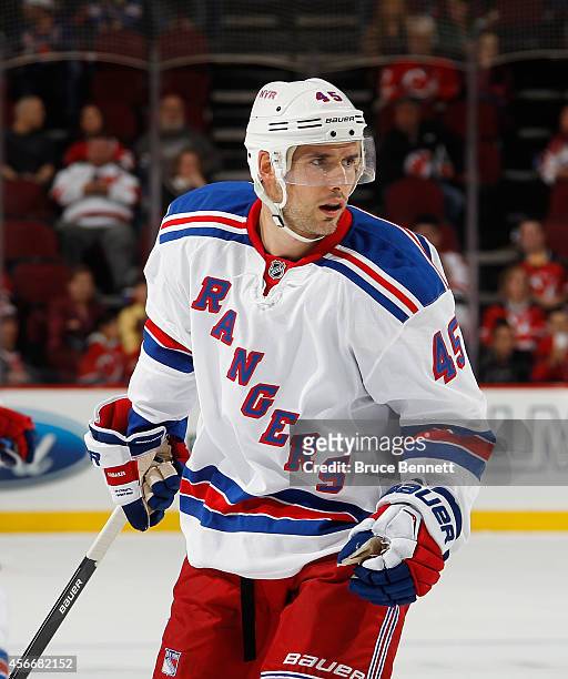 Matthew Lombardi of the New York Rangers skates against the New Jersey Devils at the Prudential Center on October 4, 2014 in Newark, New Jersey. The...