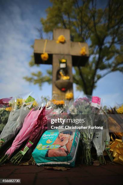 Floral tributes and yellow ribbons continue to be left by memebers of the public the 'Eccles Cross' in memory of murdered British aid worker Alan...