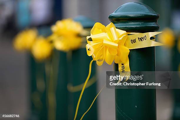 Yellow ribbons with 'Our Hero' written on them, now cover Eccles town centre in memory of murdered British aid worker Alan Henning on October 5, 2014...