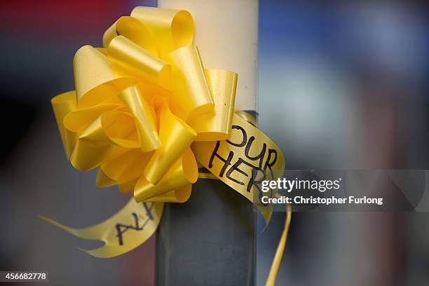 Yellow ribbons with 'Our Hero' written on them, now cover Eccles town centre in memory of murdered British aid worker Alan Henning on October 5, 2014...