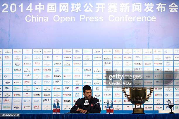 Novak Djokovic of Serbia attends a press conference after winning the men's singles final match against Tomas Berdych of the Czech Republic during...