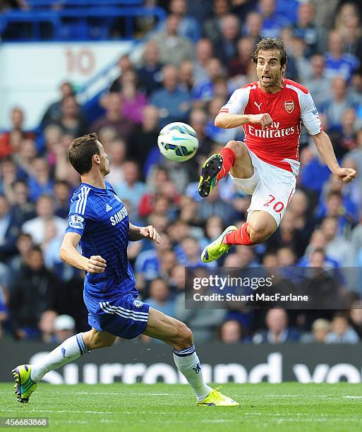 Mathieu Flamini of Arsenal challenged Nemanja Matic of Chelsea during the Barclays Premier League match between Chelsea and Arsenal at Stamford...